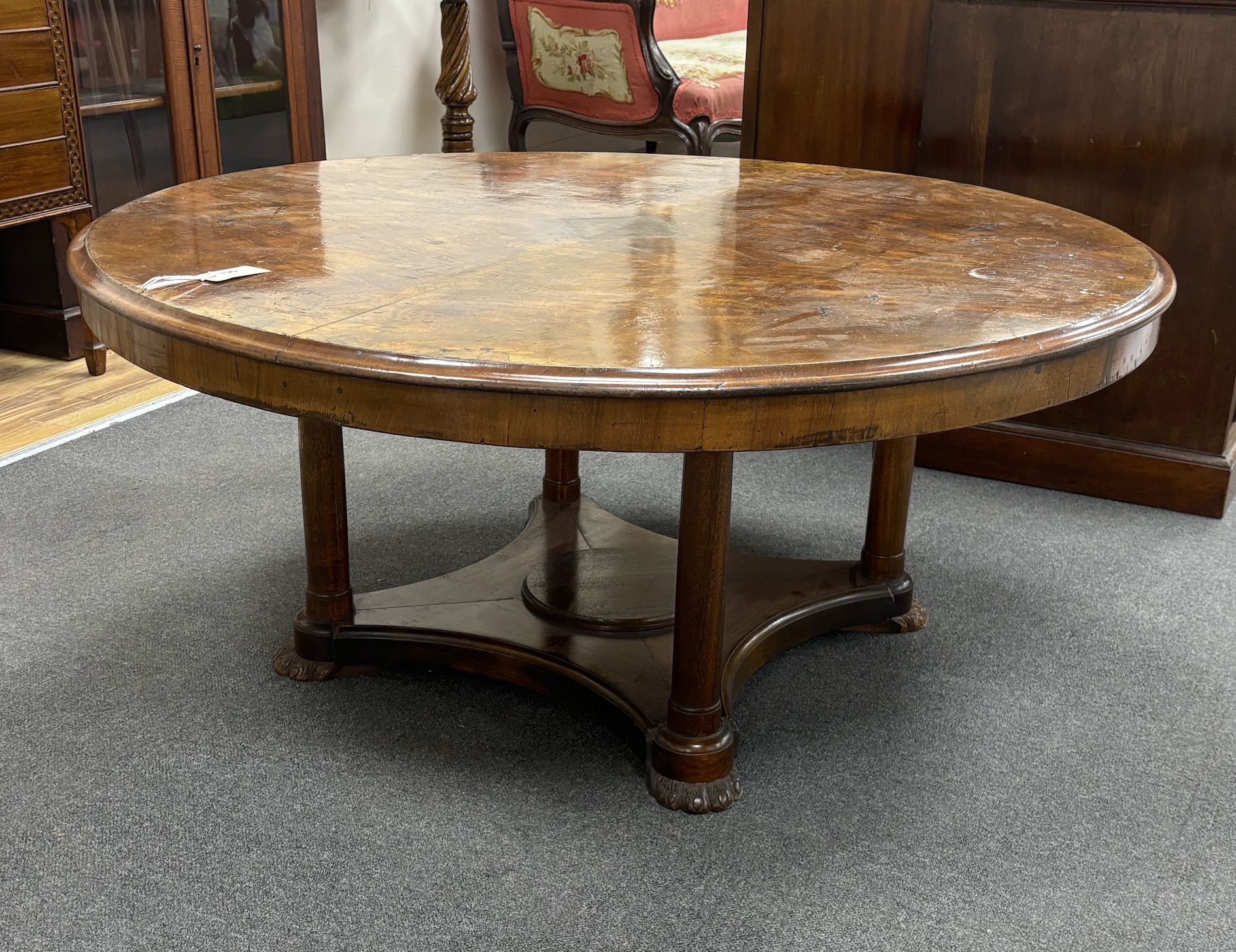 A 19th century and later circular Continental walnut low table, adapted and height reduced, diameter 120cm, height 53cm